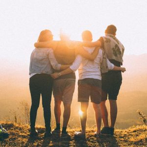 People embraced looking at sunset