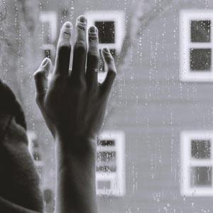The hand on the window gives a sense of isolation one feels when suffering from Emetophobia
